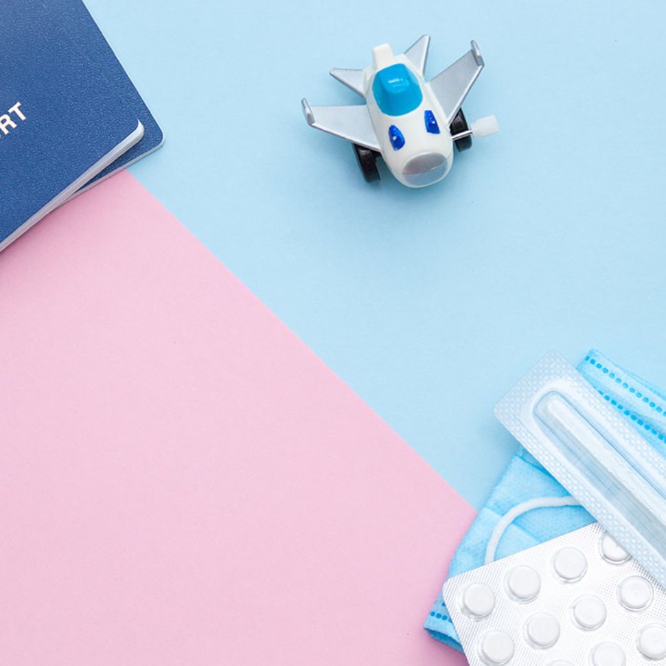 Travel health essentials with passport, airplane and medical supplies